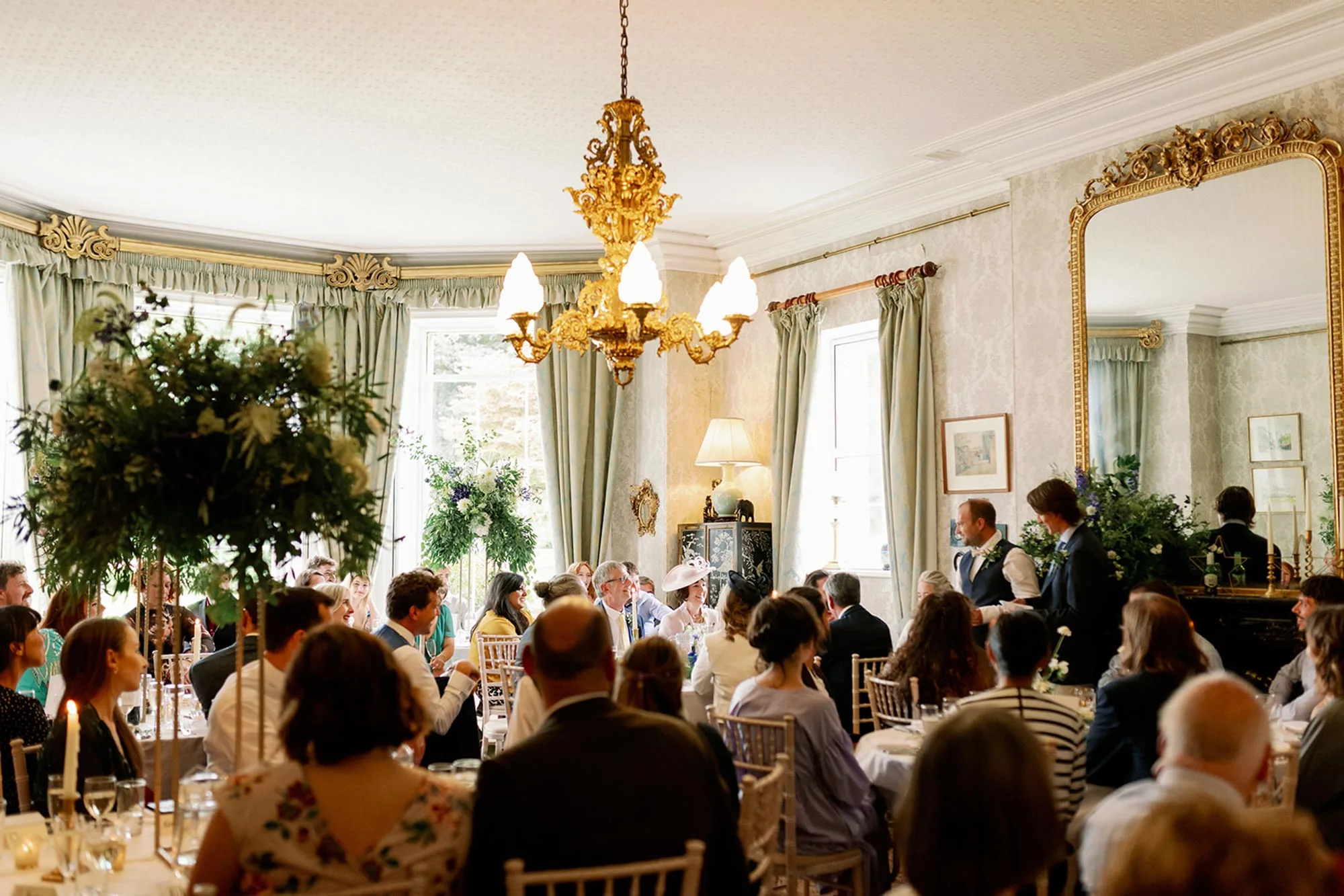 Two-groomsmen-give-wedding-speech-in-Homme-House-dining-room
