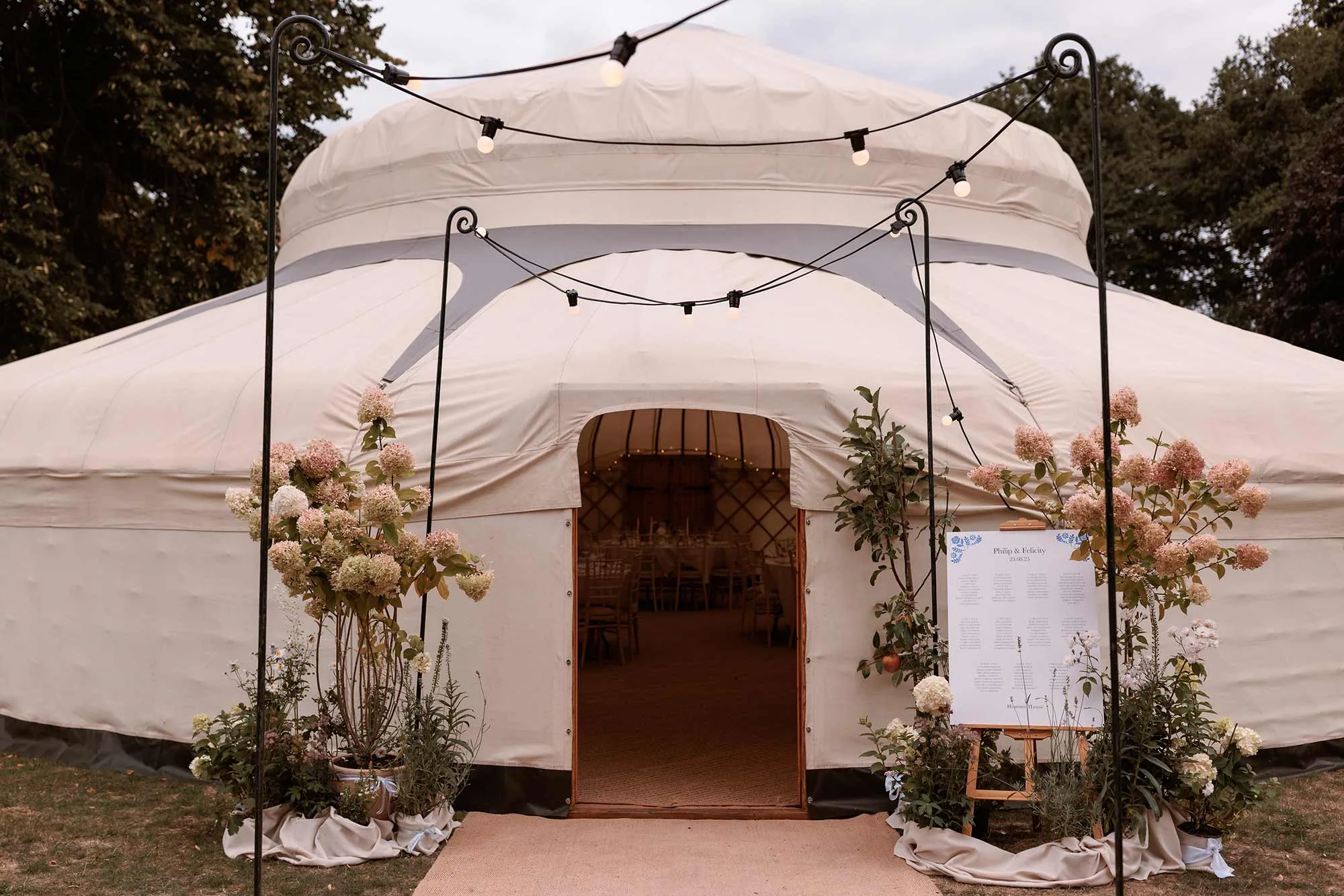 Entrance-to-yurt-with-festoon-on-Homme-House-wedding-day-2