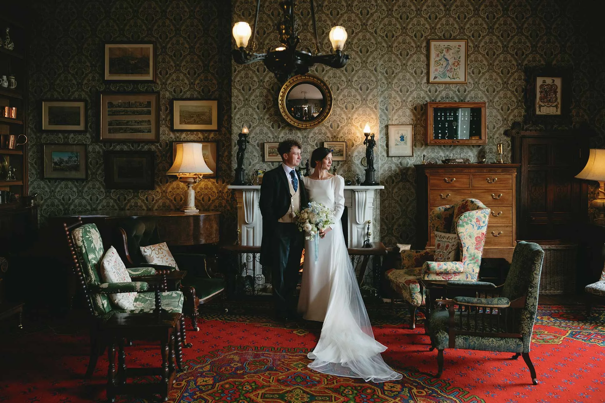 Portrait-of-bride-and-groom-in-Library-at-Homme-House