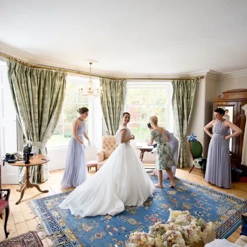 Bride and bridesmaids getting ready in the Bridal Suite at Homme House