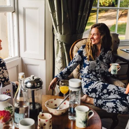 Bride and bridesmaids enjoying breakfast in the Bridal Suite at Homme House