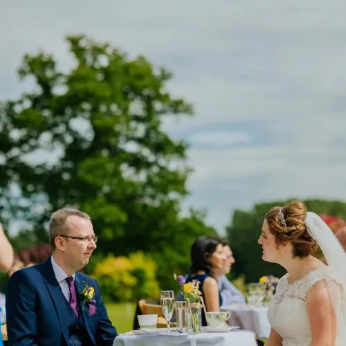 Bride and Groom enjoying afternoon tea on the main lawn at Homme House