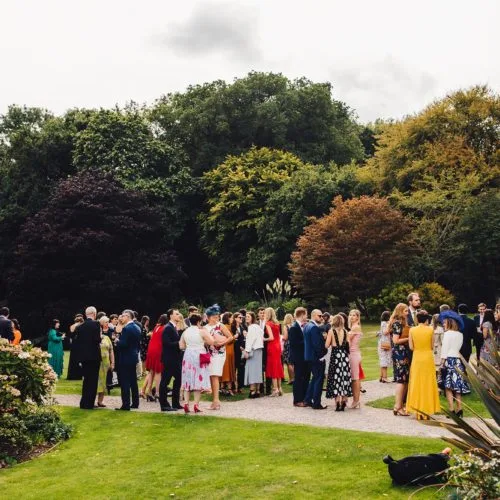 Wedding guests on main lawn at Homme House