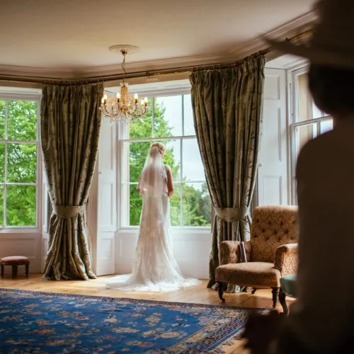 Bride looking out of Bridal Suite window