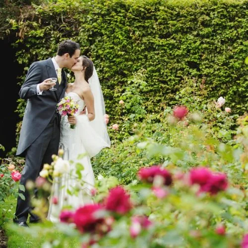 Wedding couple portrait in the rose garden at Homme House