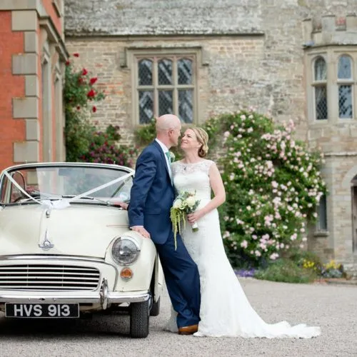 Wedding couple and car outside Homme House