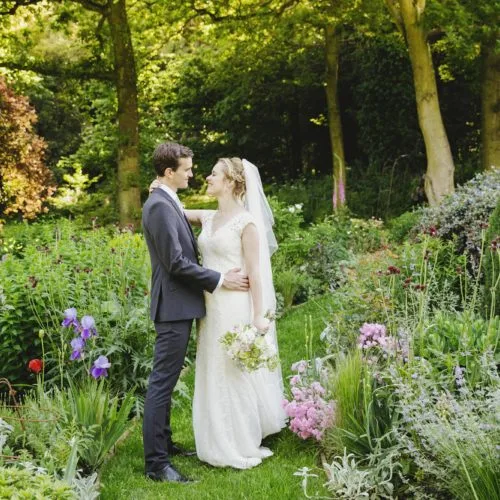 Wedding couple portrait in water garden at Homme House