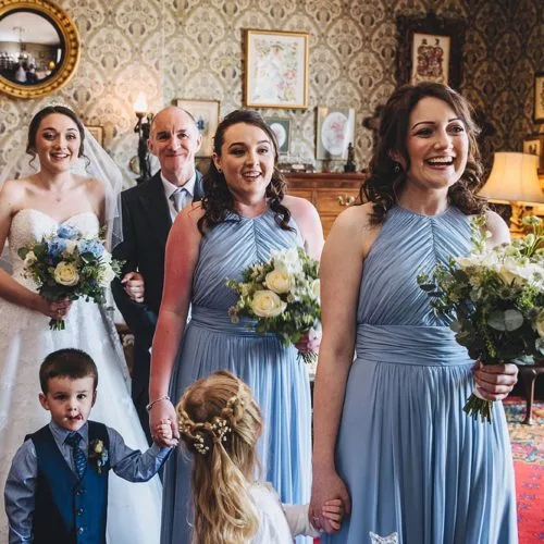Bride, Father of the Bride and bridesmaids waiting to enter a wedding ceremony at Homme House