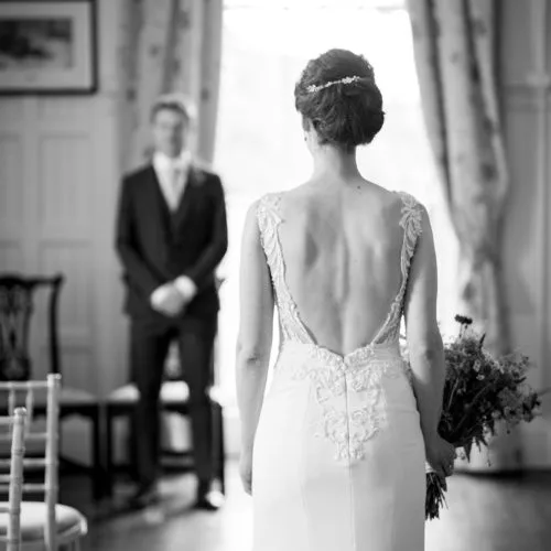A bride and groom meet in the Panelled Room at Homme House