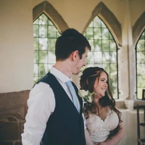 A bride and groom in the Summerhouse at Homme House