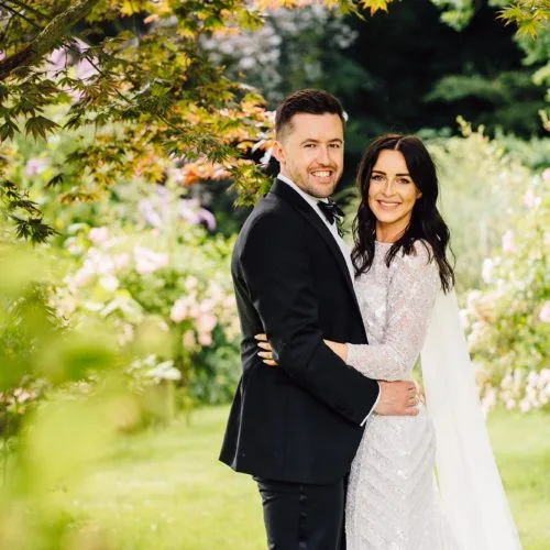 A wedding couple portrait under the acer on the main lawn at Homme House