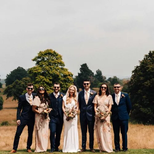 A group photo with the parkland in the background