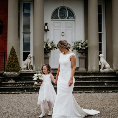 Bride-and-daughter-on-gravel-outside-Georgian-Homme-House