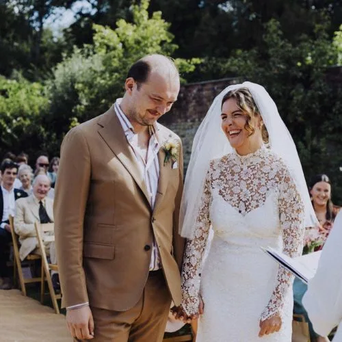 Bride-and-groom-enjoying-outdoor-wedding-ceremony-at-Homme-House