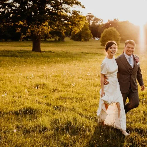 Bride-and-groom-in-evening-sunshine-in-Homme-House-parkland