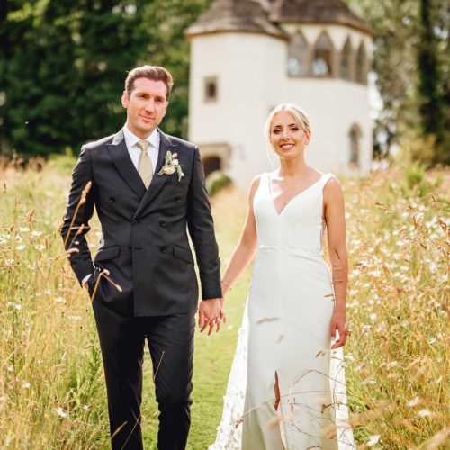 Bride-and-groom-in-wildflower-meadow-at-Homme-House