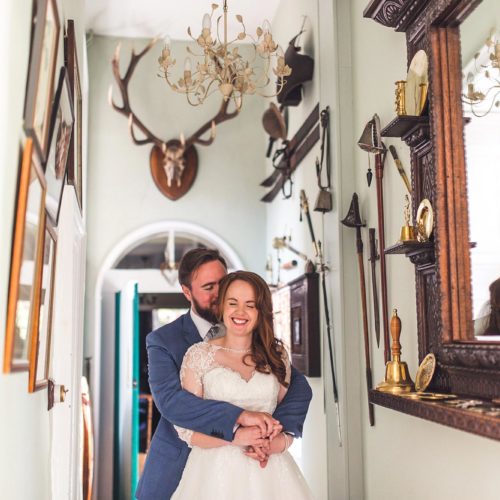 Bride-and-groom-portrait-under-stags-antlers