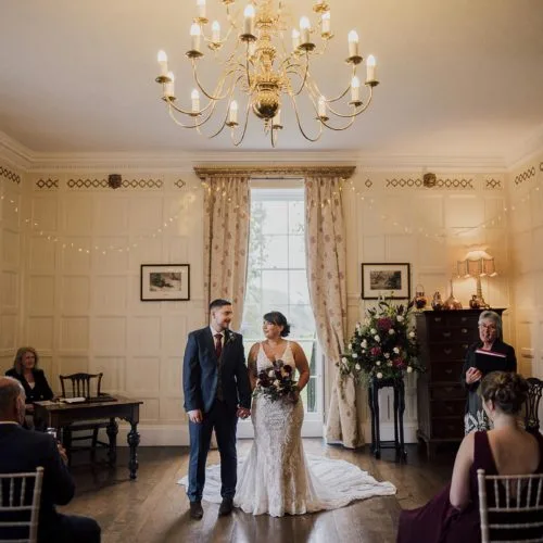 Bride-and-groom-prepare-to-leave-indoor-Homme-House-wedding-ceremony