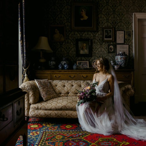 Bride-poses-on-Library-sofa