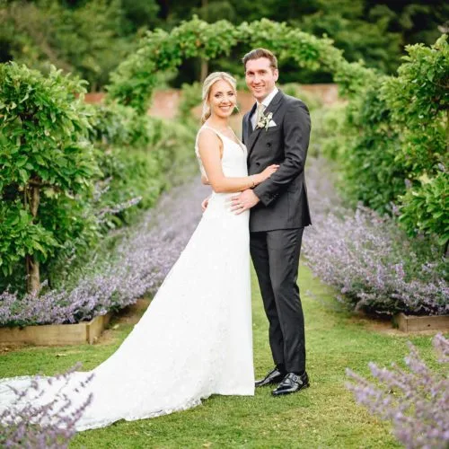 Couple-Portrait-Apple-Espalier-with-Catmint