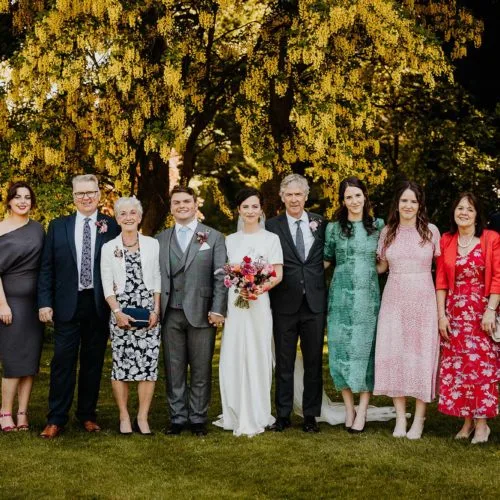 Family-group-photograph-under-laburnum-at-Homme-House-wedding