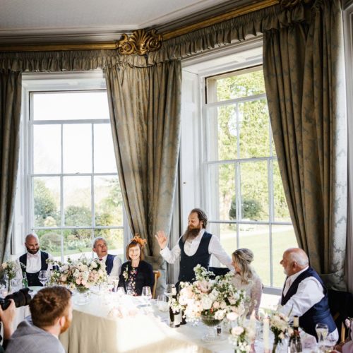 Groom-gives-wedding-speech-in-Homme-House-bay-window