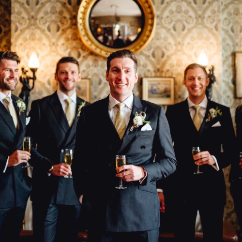 Groomsmen-group-photograph-in-Homme-House-Library