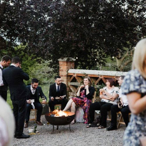 Guests-relax-around-a-firebowl