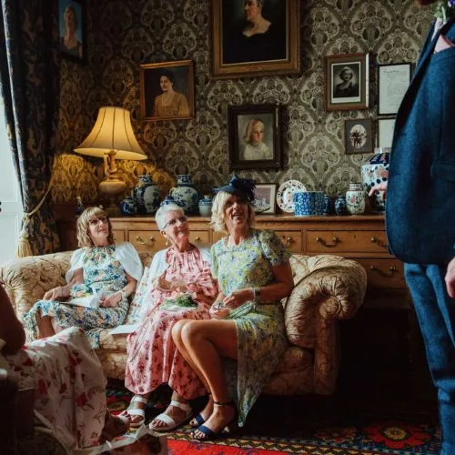 Guests-relax-on-sofa-in-Homme-House-Library