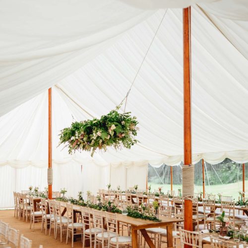 Hanging-floral-arrangement-in-marquee-at-Homme-House