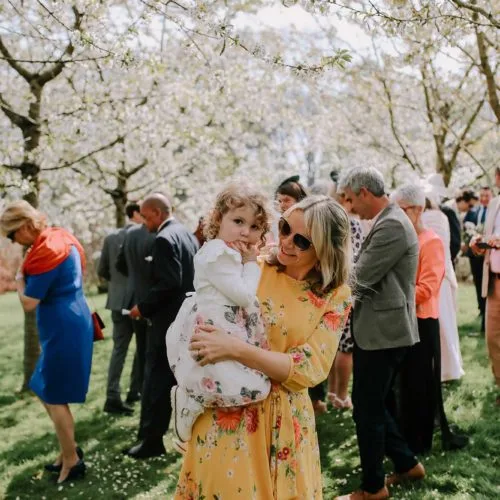 Mother-and-daughter-under-blossom-in-Homme-House-walled-garden