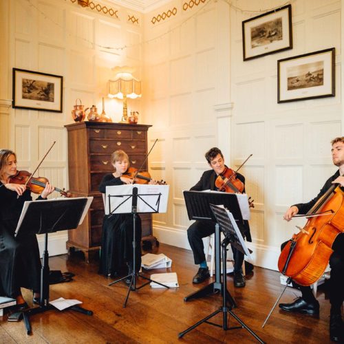 String-quartet-playing-in-Homme-House-Panelled-Room
