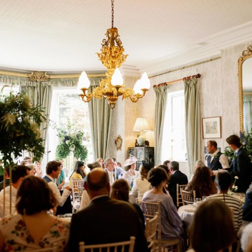 Two-groomsmen-give-wedding-speech-in-Homme-House-dining-room