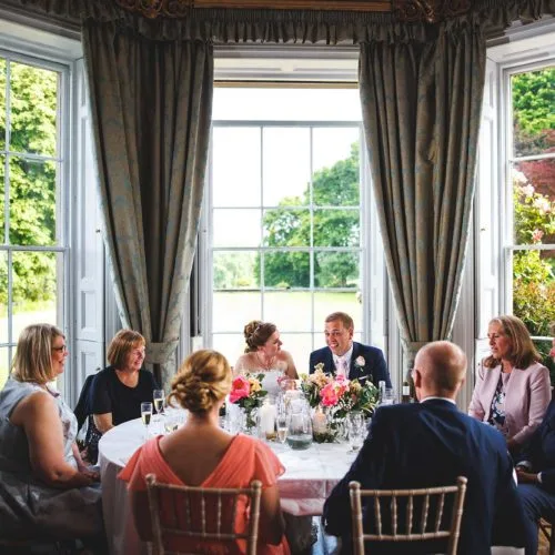Wedding-breakfast-top-table-in-bay-window-at-Homme-House