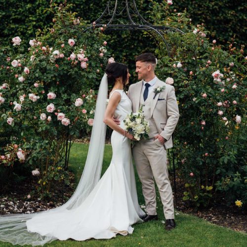 Wedding-couple-in-Homme-House-rose-garden