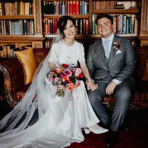 Wedding-couple-on-Library-sofa-at-Homme-House