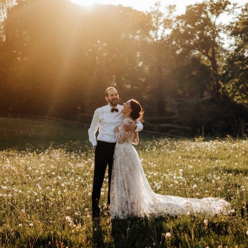 Bride-and-groom-in-evening-sunshine-in-Homme-House-parkland