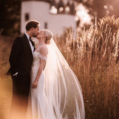 Bride-and-groom-in-evening-sunshine-in-Homme-House-walled-garden