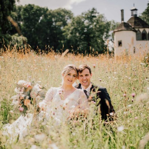 Bride-and-groom-in-wild-flower-meadow-at-Homme-House