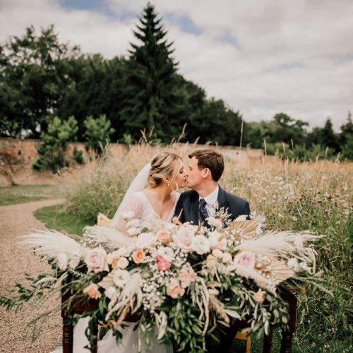 Bride-and-groom-kiss-while-signing-marriage-register