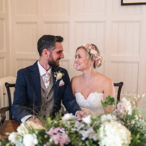 Bride-and-groom-sign-marriage-register-in-Homme-House-Panelled-Room