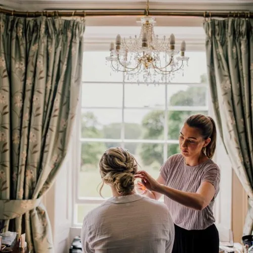 Bride-has-hair-done-in-Homme-House-Bridal-Suite