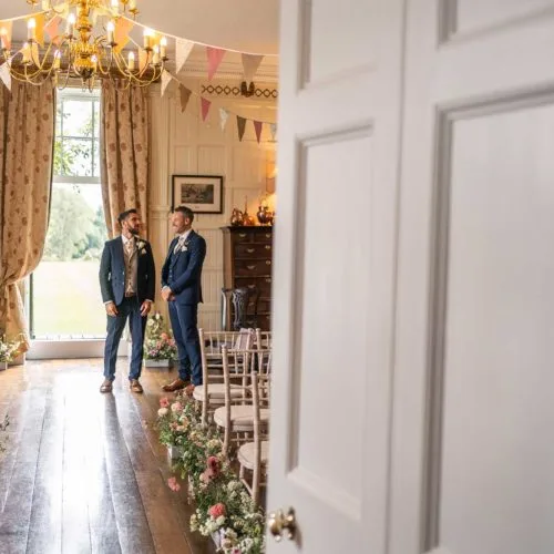 Groom-and-best-man-wait-for-start-of-wedding-ceremony