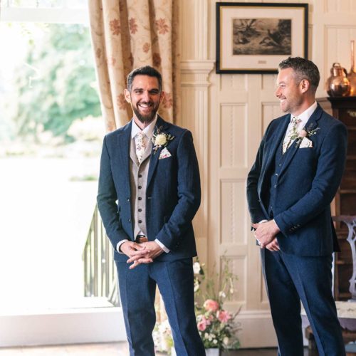 Groom-and-best-man-wait-for-start-of-wedding-ceremony