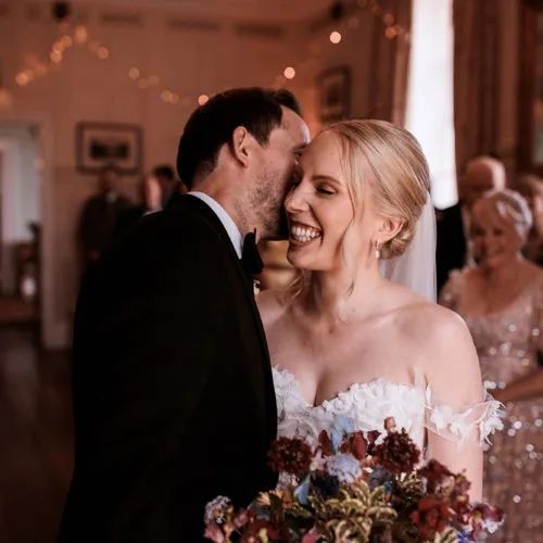 Groom-kisses-bride-during-wedding-ceremony