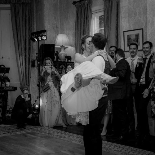 Groom-lifts-bride-during-first-dance