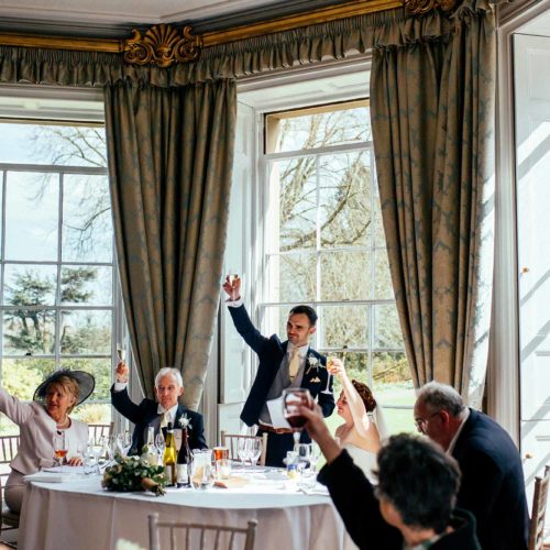 Groom-proposes-a-toast-in-Homme-House-Dining-Room