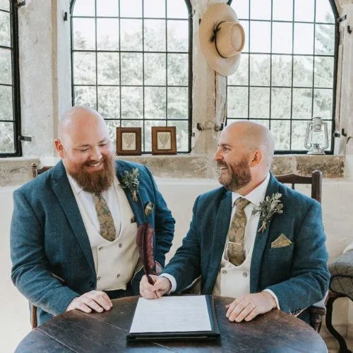 Grooms-sign-marriage-register-in-Homme-House-Summerhouse
