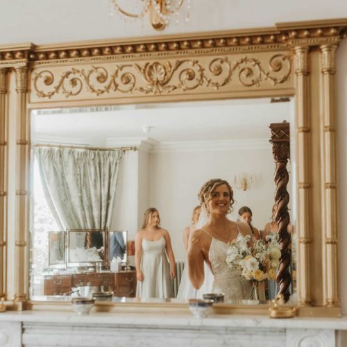 Portrait-of-bride-in-Bridal-Suite-mirror-at-Homme-House
