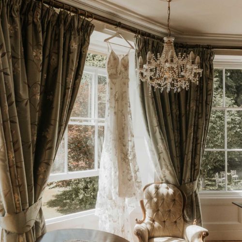 Wedding-dress-hanging-in-Bridal-Suite-at-Homme-House